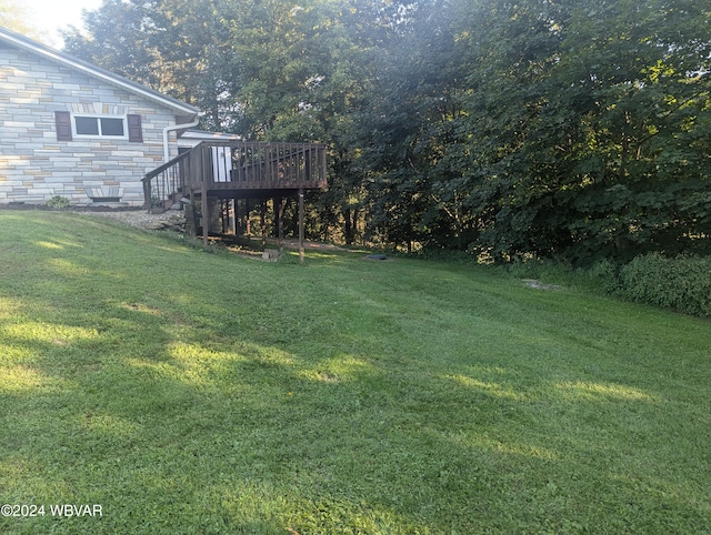 view of yard featuring a wooden deck