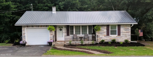 view of front of property with a garage and covered porch