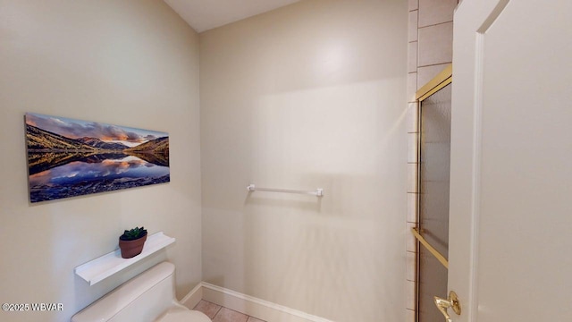 2180 Stopper Dr, Montoursville, PA 17754 - bathroom with toilet, an enclosed shower, baseboards, and tile patterned flooring