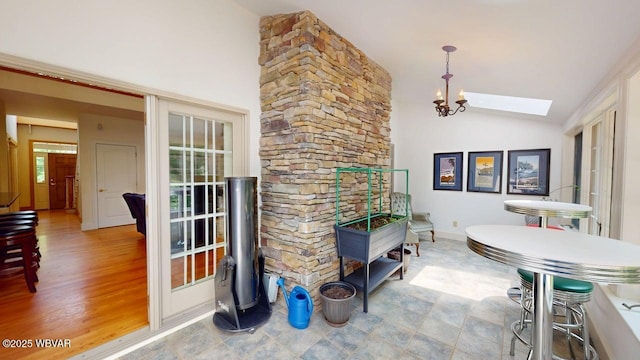 2180 Stopper Dr, Montoursville, PA 17754 - dining room with a skylight, baseboards, and high vaulted ceiling