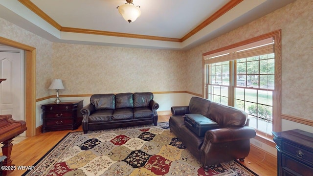 2180 Stopper Dr, Montoursville, PA 17754 - living room featuring ornamental molding, wood finished floors, wallpapered walls, and a wainscoted wall