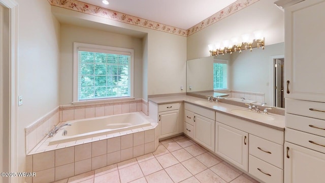 2180 Stopper Dr, Montoursville, PA 17754 - full bathroom with healthy amount of natural light, a garden tub, double vanity, and tile patterned flooring