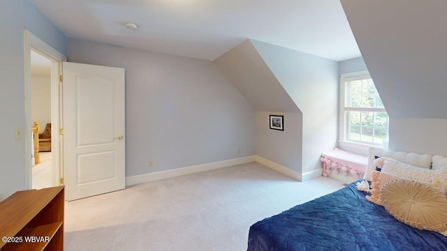 2180 Stopper Dr, Montoursville, PA 17754 - carpeted bedroom with lofted ceiling and baseboards