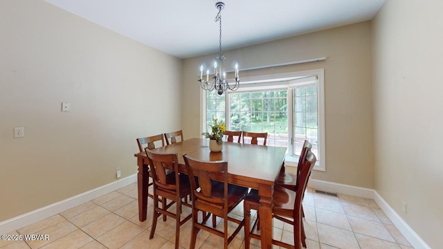 2180 Stopper Dr, Montoursville, PA 17754 - dining room with a chandelier, light tile patterned floors, and baseboards