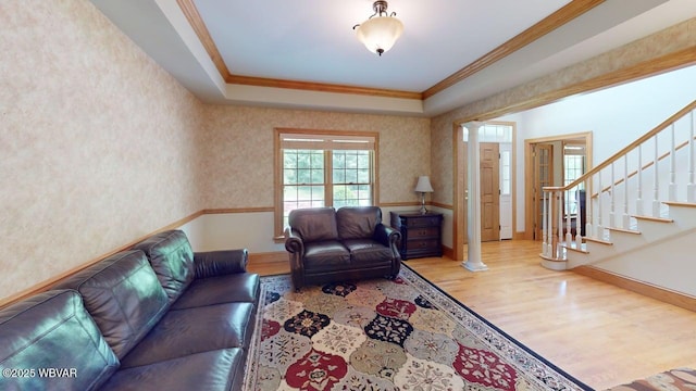 2180 Stopper Dr, Montoursville, PA 17754 - living room with wood finished floors, crown molding, stairs, and baseboards