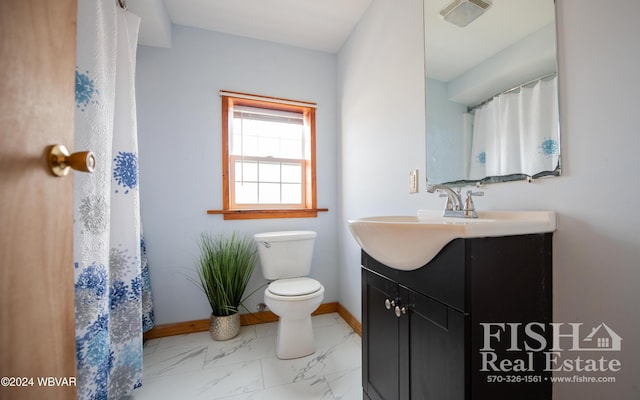 bathroom with vanity and toilet