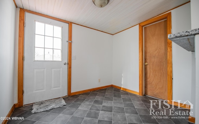 doorway to outside featuring wood ceiling and crown molding