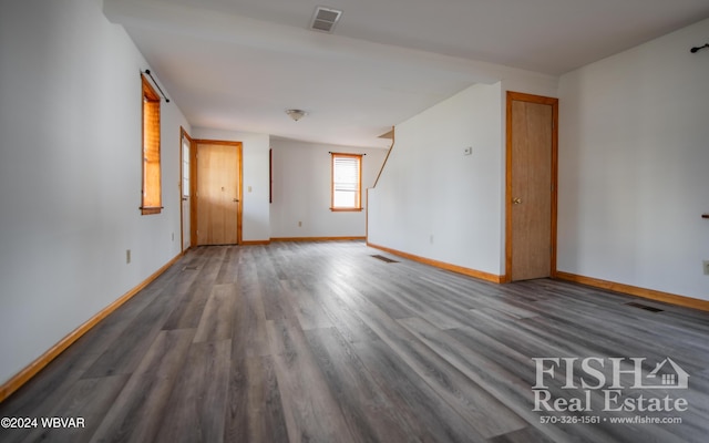 empty room featuring dark wood-type flooring