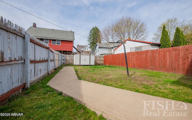 435 Grant St, Williamsport, PA 17701 - view of yard with a fenced backyard, a storage unit, and an outdoor structure