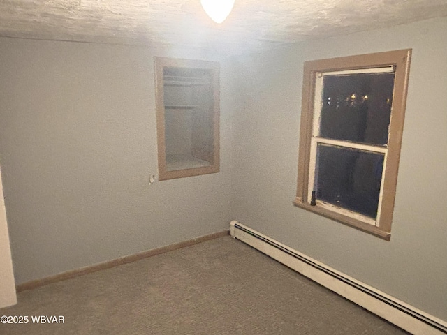 145 Gulick St, Blossburg, PA 16912 - empty room featuring baseboard heating, a textured ceiling, and baseboards