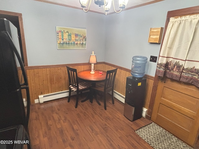 145 Gulick St, Blossburg, PA 16912 - dining room with baseboard heating, an inviting chandelier, and wainscoting