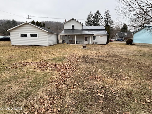 145 Gulick St, Blossburg, PA 16912 - rear view of house with metal roof and a yard