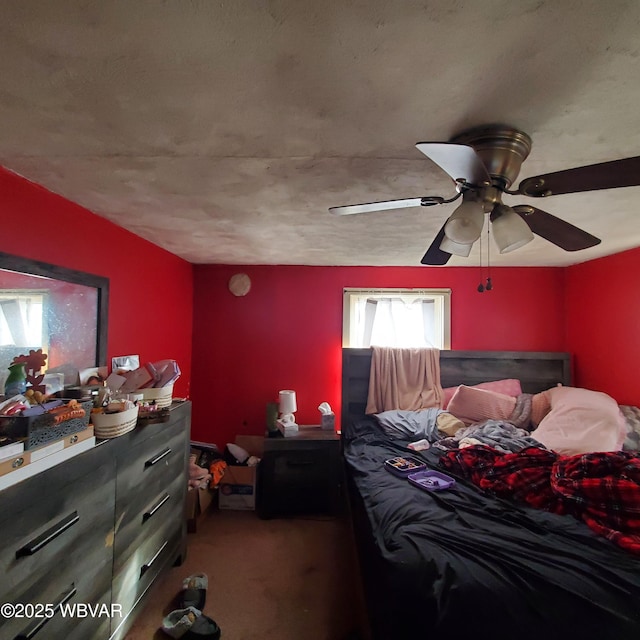 bedroom with ceiling fan and carpet