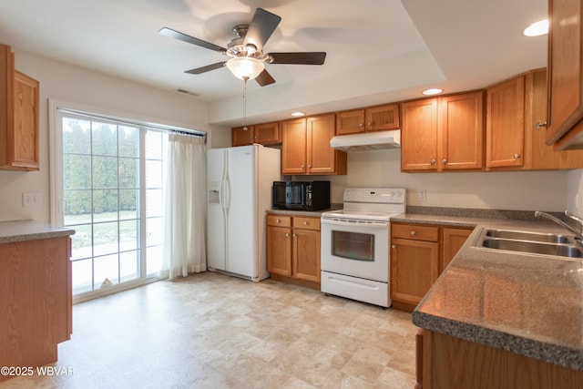 kitchen featuring ceiling fan, sink, and white appliances