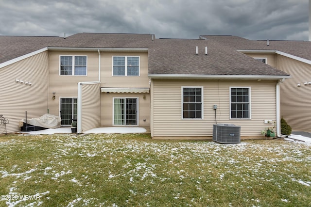 rear view of property with a patio and a yard