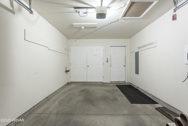 garage featuring a garage door opener and electric panel