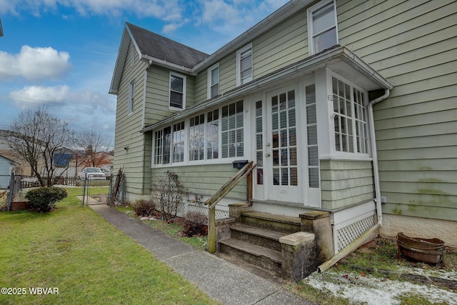 entrance to property with a yard