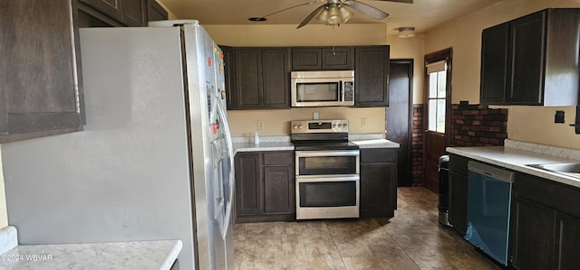 kitchen with dark brown cabinetry, stainless steel appliances, and ceiling fan