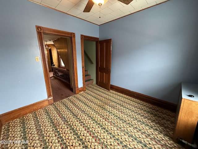 unfurnished bedroom featuring ceiling fan