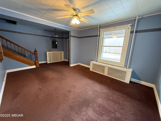 interior space featuring ceiling fan, ornamental molding, and radiator