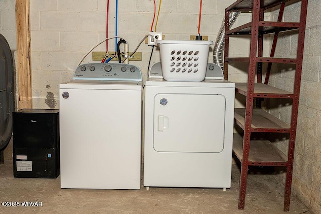 229 River Rd, Renovo, PA 17764 - laundry room featuring separate washer and dryer, laundry area, and concrete block wall