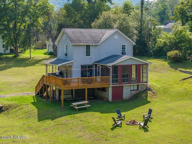 229 River Rd, Renovo, PA 17764 - back of house featuring a sunroom, stairway, a deck, a fire pit, and a lawn