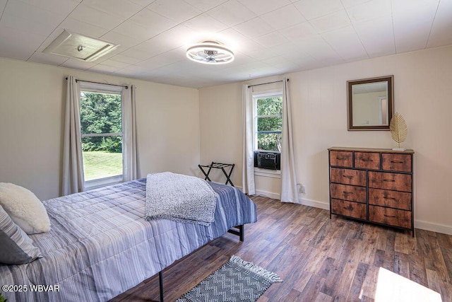 229 River Rd, Renovo, PA 17764 - bedroom featuring cooling unit, baseboards, and wood finished floors