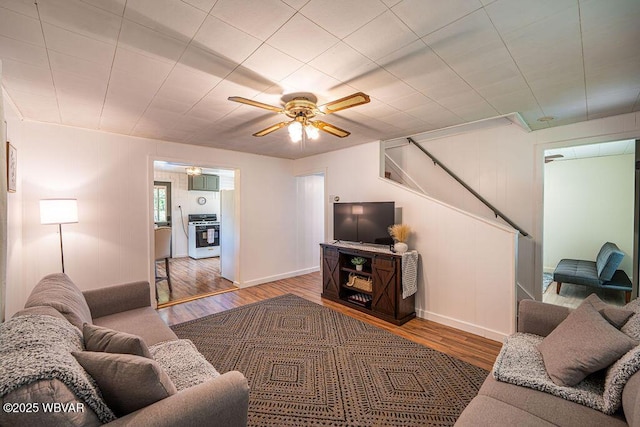 229 River Rd, Renovo, PA 17764 - living area featuring stairway, ceiling fan, and wood finished floors