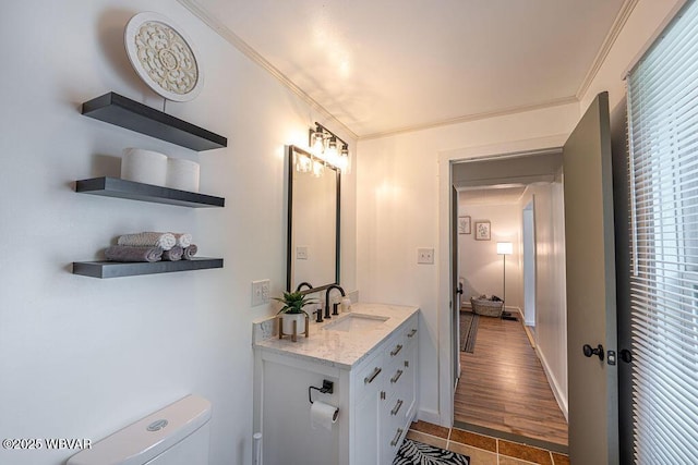 229 River Rd, Renovo, PA 17764 - half bathroom with vanity, baseboards, toilet, and crown molding