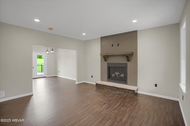 1777 Felmey Rd, Winfield, PA 17889 - unfurnished living room with dark wood-style floors, a large fireplace, baseboards, and recessed lighting