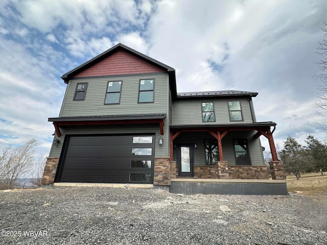 1777 Felmey Rd, Winfield, PA 17889 - view of front facade with stone siding, covered porch, gravel driveway, and a garage