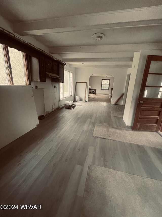 hallway with beam ceiling and wood-type flooring