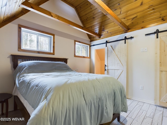 bedroom featuring wood ceiling, a barn door, light hardwood / wood-style floors, and lofted ceiling with beams