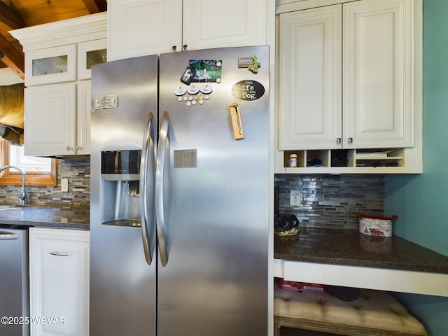 kitchen with stainless steel appliances and white cabinetry