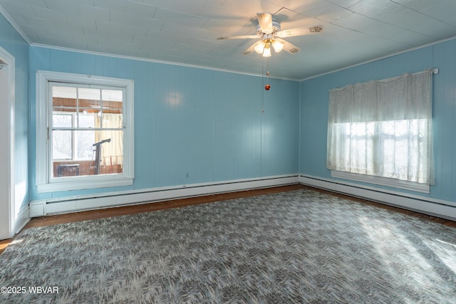 spare room with hardwood / wood-style flooring, crown molding, ceiling fan, and a baseboard radiator