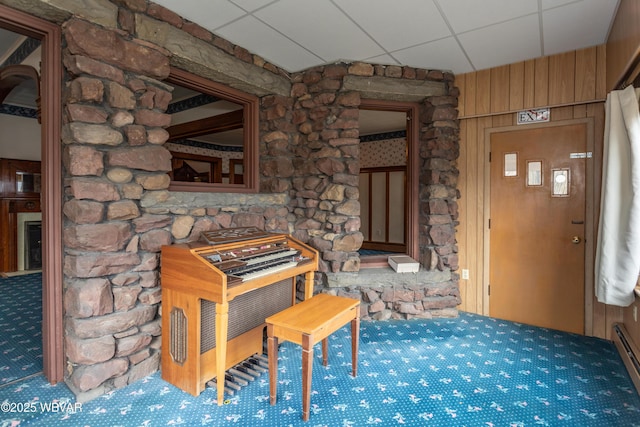 miscellaneous room featuring a paneled ceiling and baseboard heating