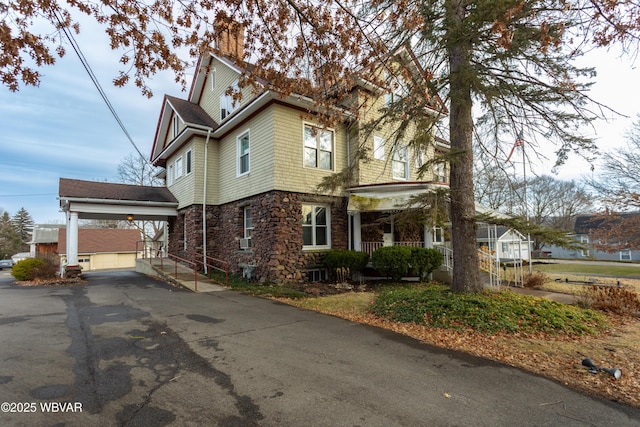 view of front facade with a garage and a carport