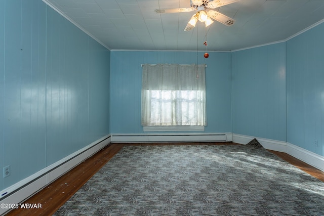 unfurnished room with ornamental molding, dark hardwood / wood-style floors, ceiling fan, and baseboard heating