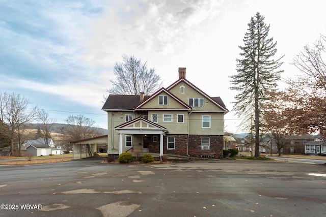 view of front of house featuring a carport