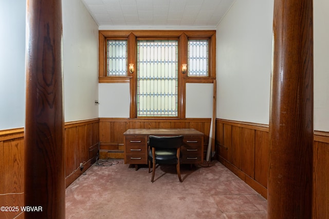 office area featuring ornamental molding, carpet, and wood walls