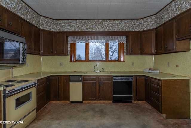 kitchen featuring dark brown cabinetry, sink, and black appliances