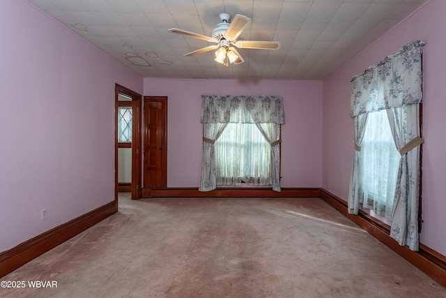 carpeted empty room with ceiling fan