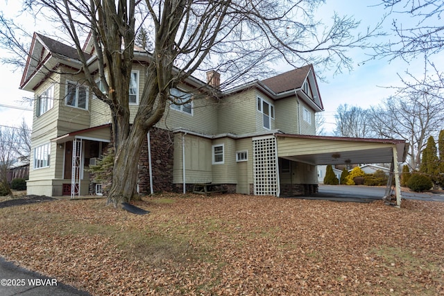 view of home's exterior with a carport