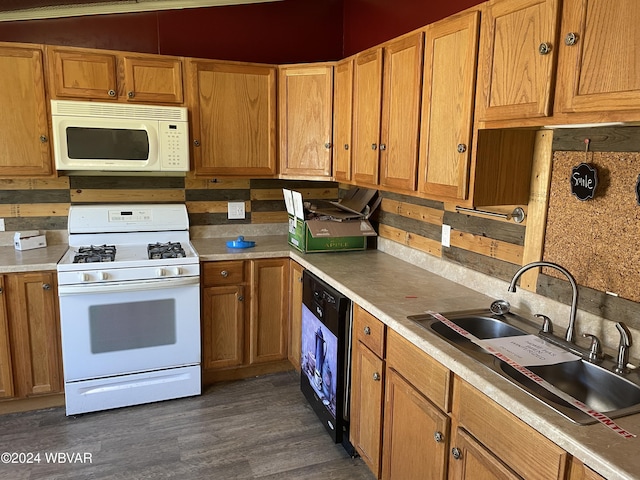 kitchen featuring decorative backsplash, dark hardwood / wood-style flooring, white appliances, and sink