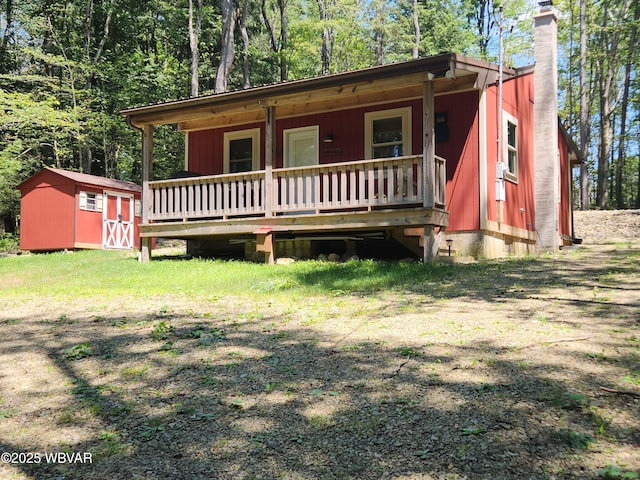 110 Worlds End Rd, Muncy Valley, PA 17758 - view of front of property with a shed, covered porch, and a chimney