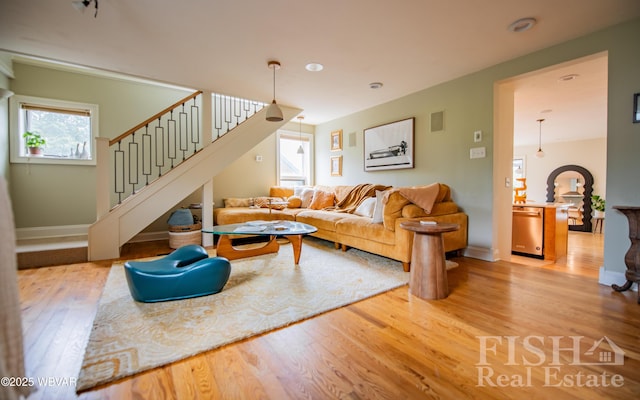 335 Chirlton Pt, Montoursville, PA 17754 - living room featuring wood finished floors, stairway, and baseboards