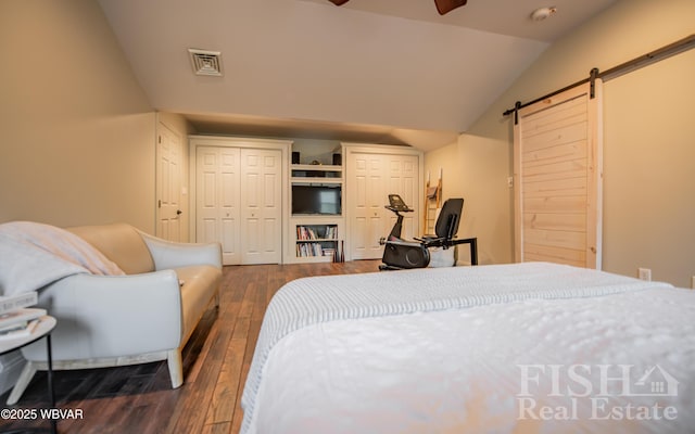 335 Chirlton Pt, Montoursville, PA 17754 - bedroom featuring a barn door, lofted ceiling, dark wood finished floors, and a closet