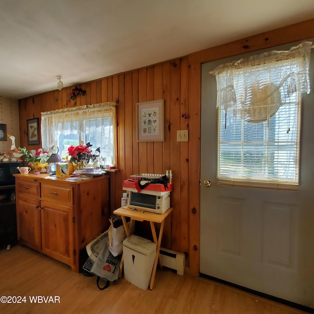 interior space with light hardwood / wood-style flooring and baseboard heating