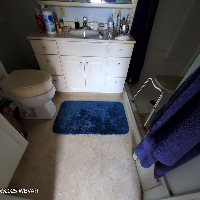 bathroom featuring vanity, toilet, and walk in shower