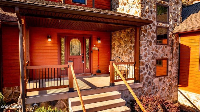 property entrance with covered porch